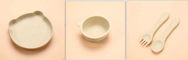 Set of ceramic and wooden tableware on a peach background