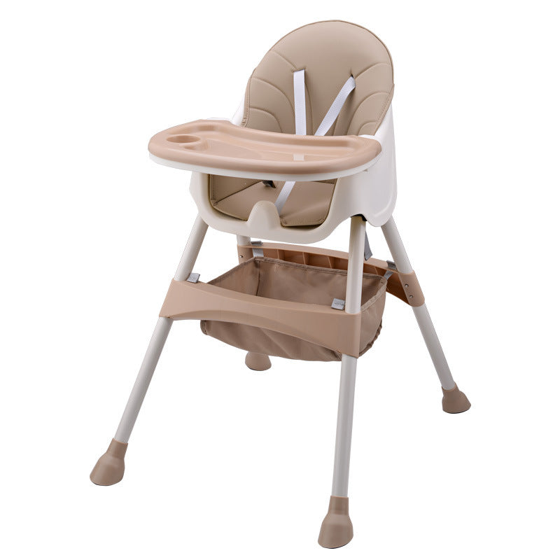 Beige and white high chair with tray on a white background