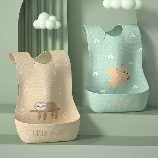 Two baby bibs with animal designs on a green background