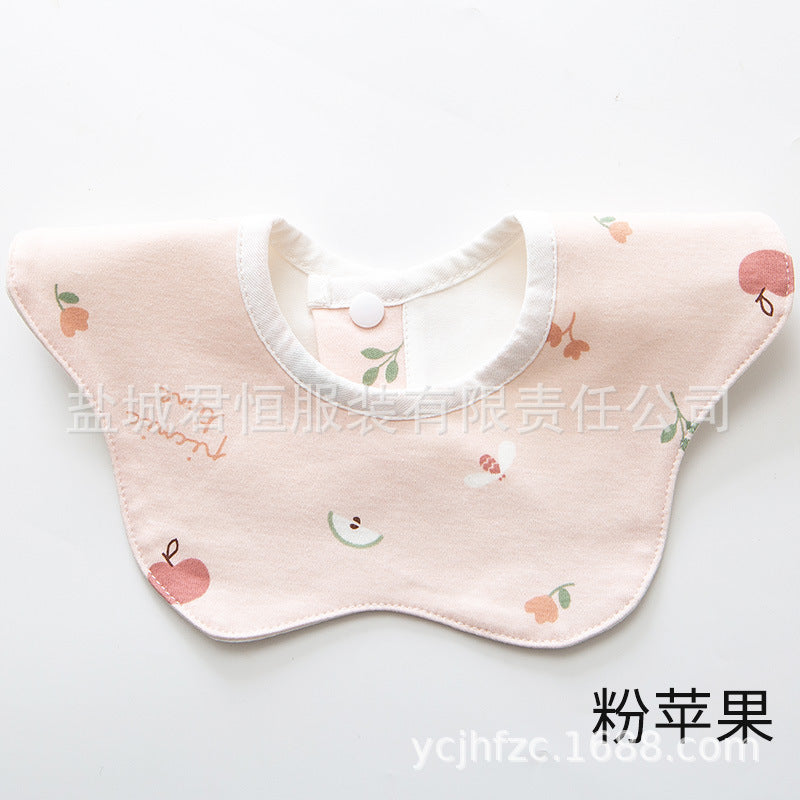 Baby bib with apple pattern on a white background