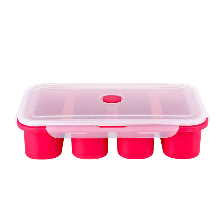 Pink ice cube tray with clear lid on a white background