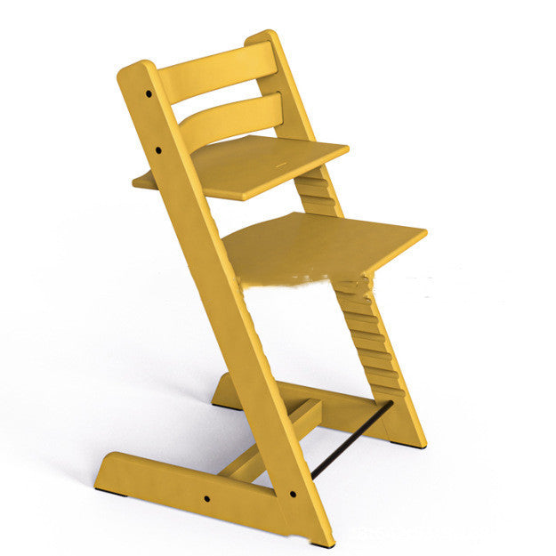 Yellow wooden high chair on a white background