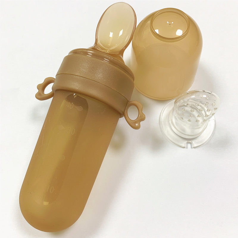 Baby bottle with accessories on a white background