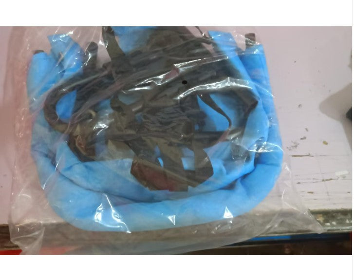 Blue and black cable in clear plastic packaging on a white surface