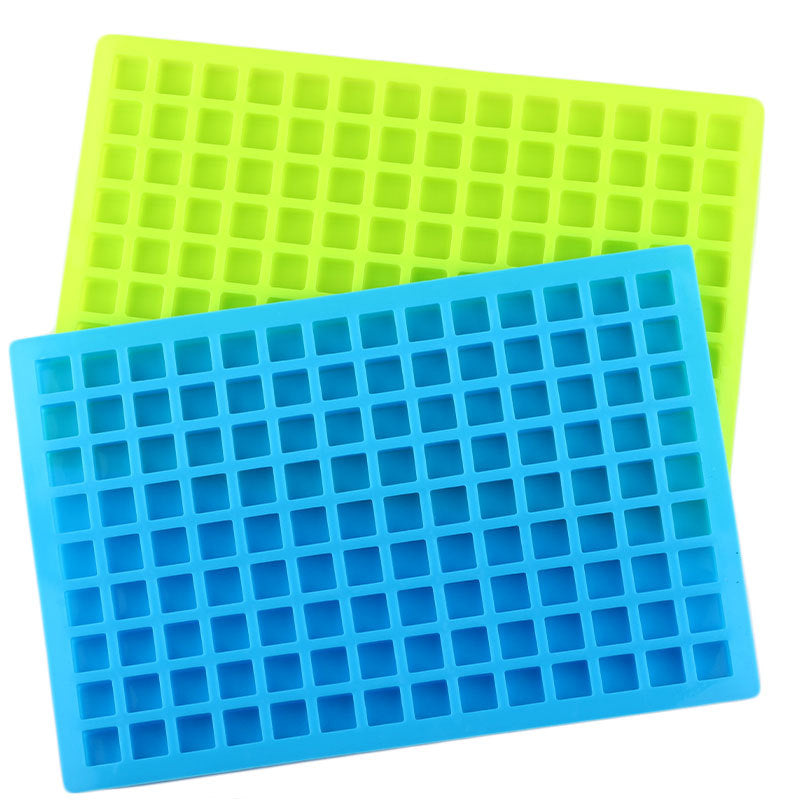 Two silicone ice cube trays, one green and one blue, on a white background.