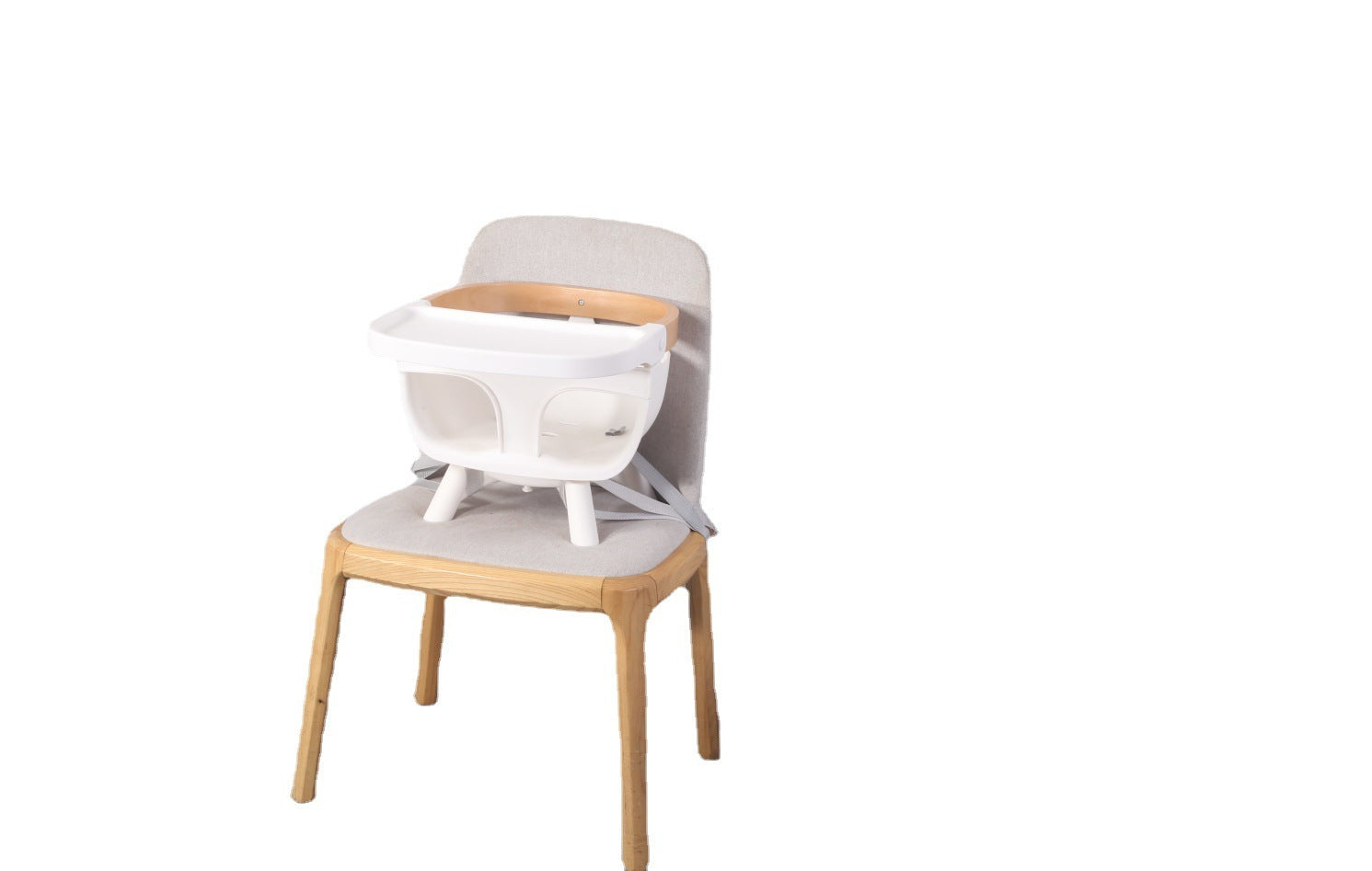 Chair with a baby seat attachment on a white background
