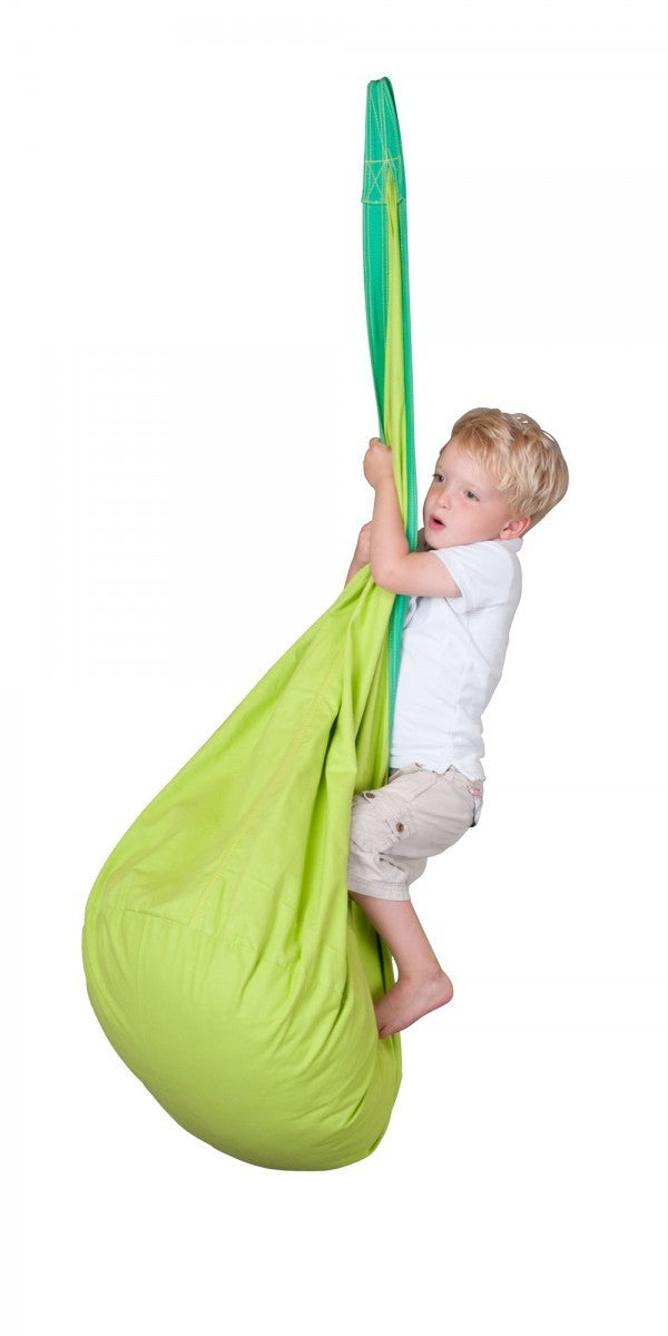 Child holding a green and yellow hoop against a white background