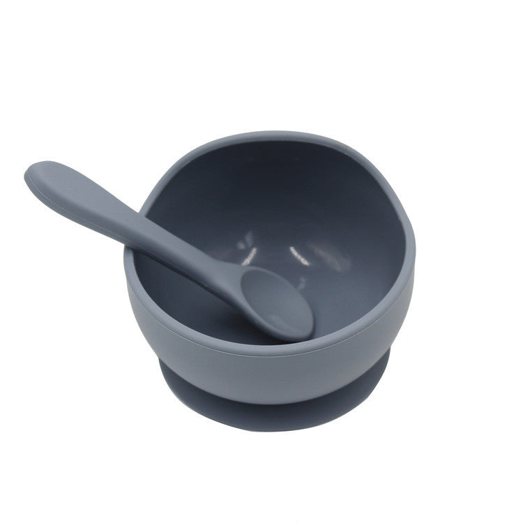 Gray bowl and spoon set on a white background