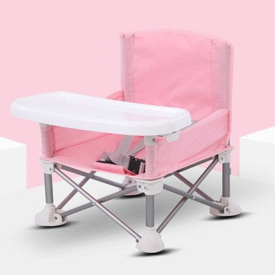 Pink and white folding chair on a light pink background
