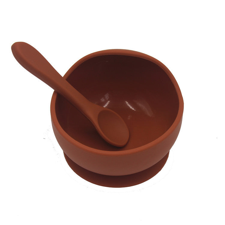 Brown bowl and spoon set on a white background