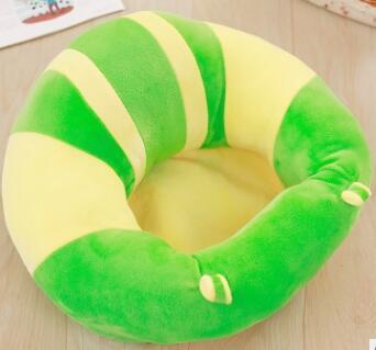 Green and yellow striped cushion on a wooden floor