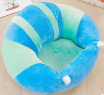 Blue and green striped baby seat on a wooden floor
