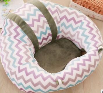 Pet bed with zigzag pattern on a wooden floor