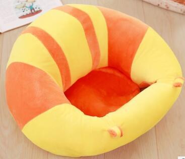 Round, colorful baby seat with orange and yellow stripes on a wooden floor.