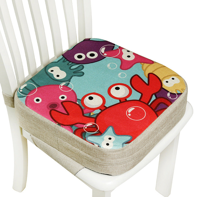 Colorful sea-themed cushion on a white chair