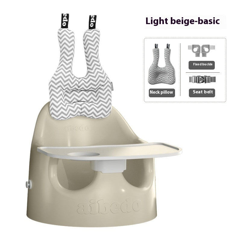 Beige baby high chair with neck pillow and seat belt features on a white background