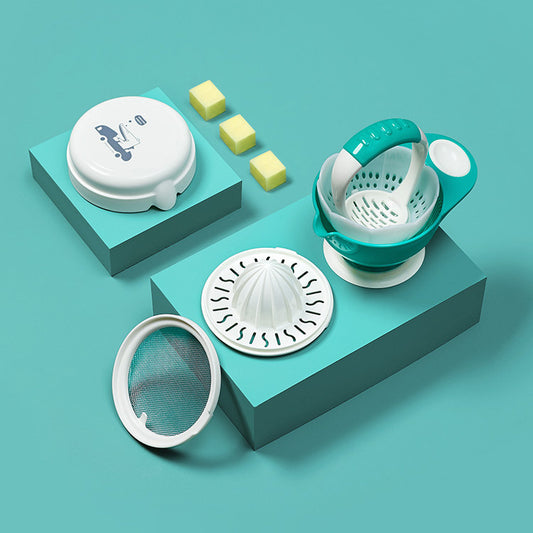Set of kitchen tools including a white lid, green strainer, and other components on a teal background