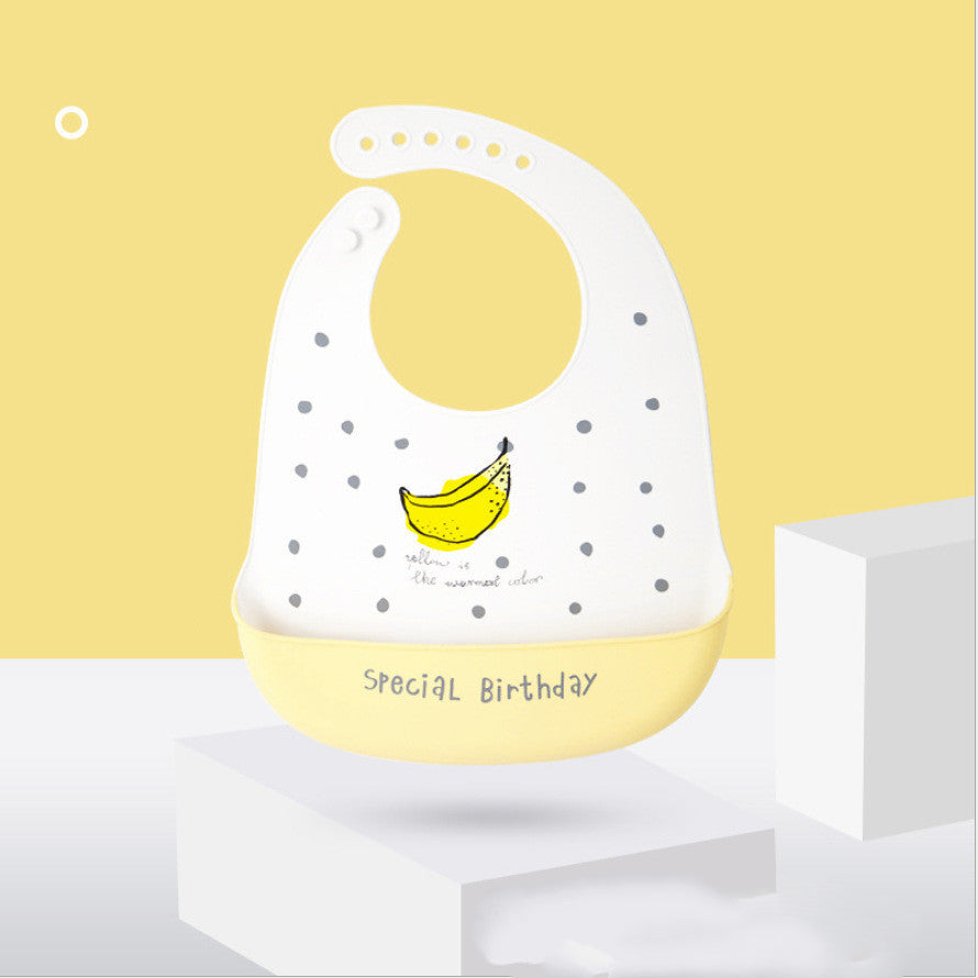 Baby bib with banana design and 'Special Birthday' text on a yellow background