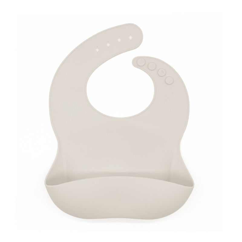 Beige silicone bib on a white background