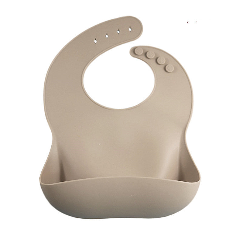 Beige silicone bib on a white background