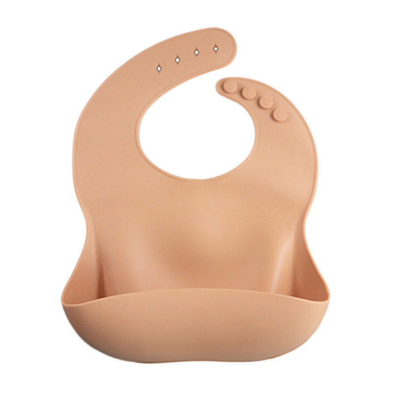 Beige silicone bib on a white background