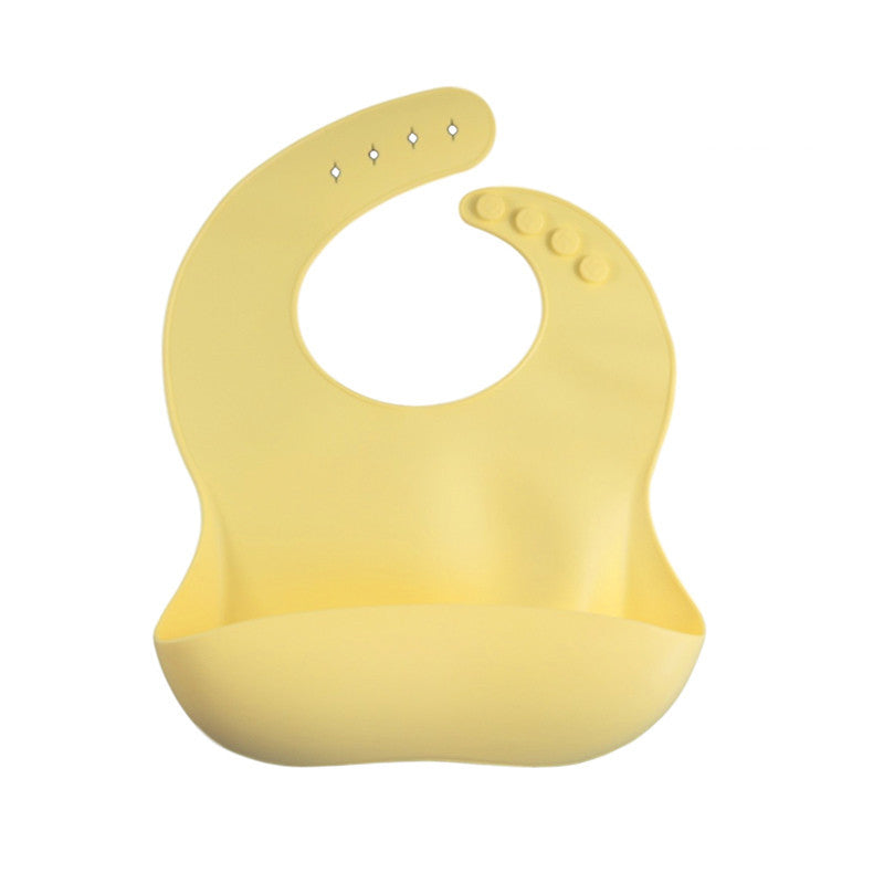 Yellow silicone bib on a white background