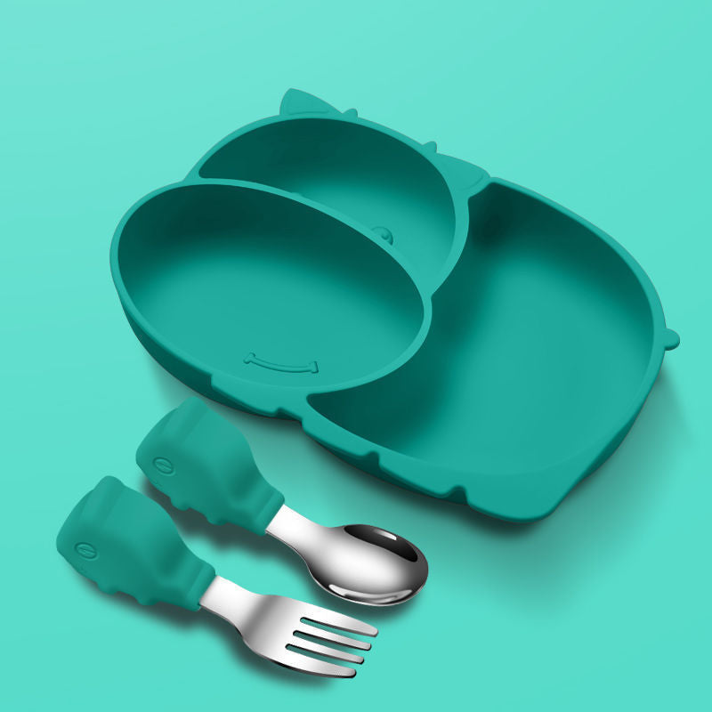 Teal silicone plate and utensils set on a teal background