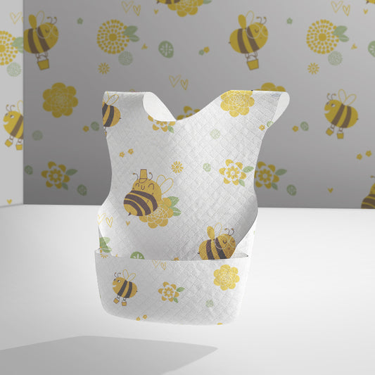 Baby bib with bee and flower pattern on a plain background