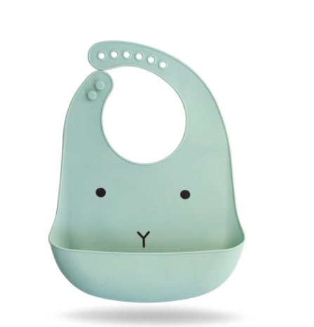 Light blue bib with a cartoon face on a white background