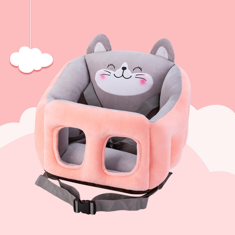 Children's safety seat with cartoon cat design on a pink background