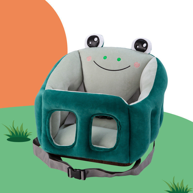 Frog-shaped baby seat with a smiley face on a green and orange background