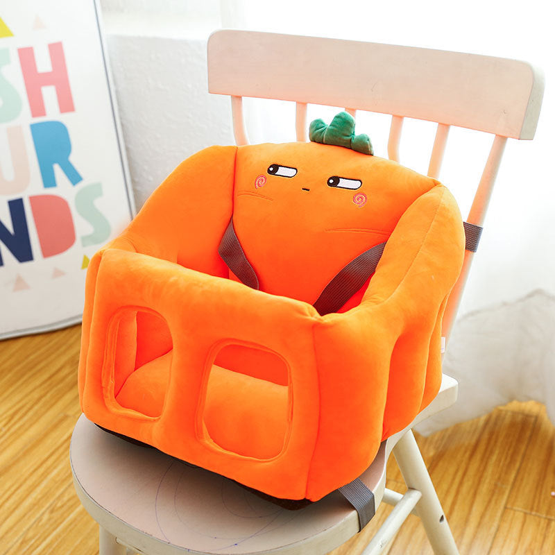 Orange baby high chair with cartoon face design on a wooden chair.