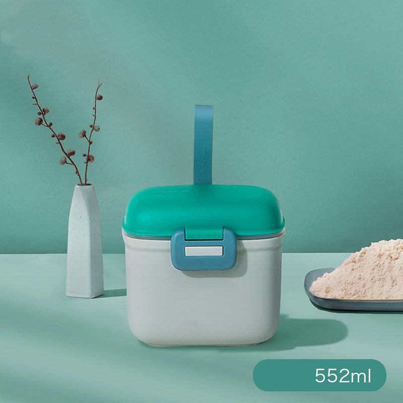 White container with teal lid and handle on a green background