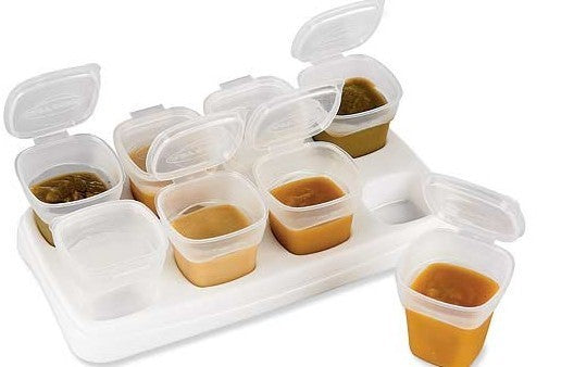 Set of plastic containers with food on a white background