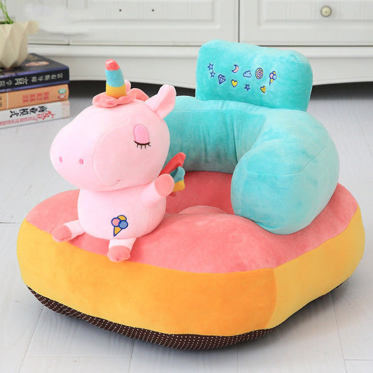 Colorful children's chair with a pink unicorn plush toy on a light wooden floor.