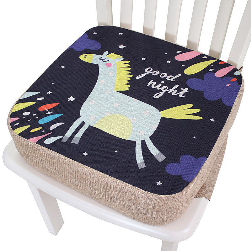 Seat cushion with cartoon giraffe design and 'good night' text on a chair.