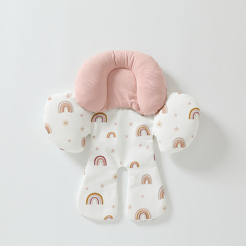 Baby support pillow with pink cushion and rainbow patterned cover on a light gray background