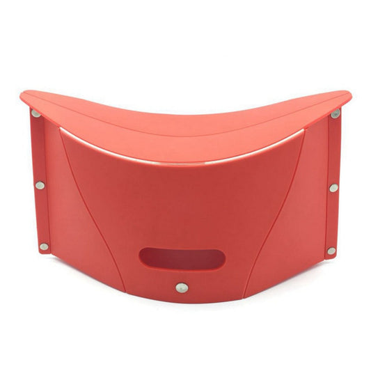 Red plastic seat with curved design on a white background
