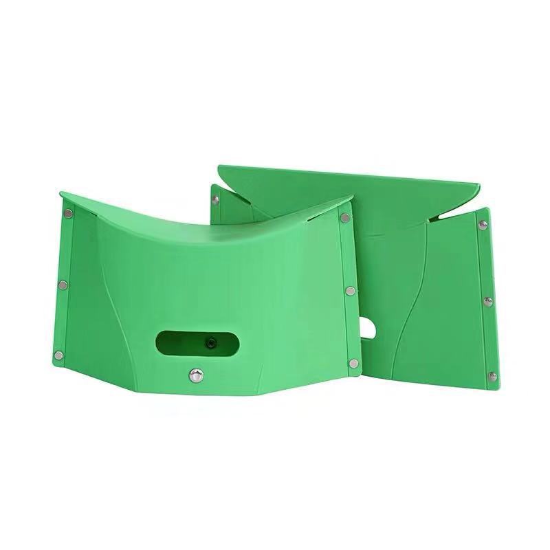 Green plastic seat cover on a white background