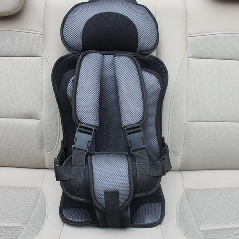 Children's car seat on a beige car seat cover