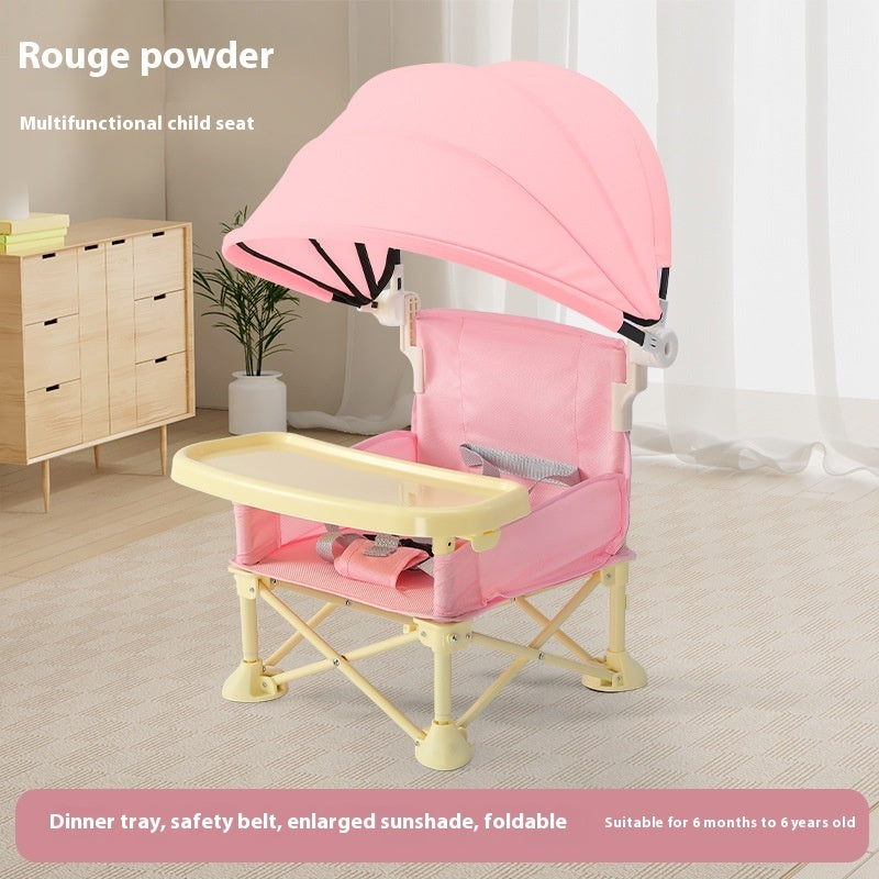 Pink multifunctional child seat with canopy in a room setting