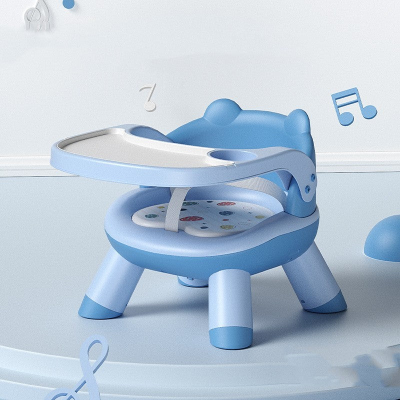 Blue children's chair with a tray on a light blue background