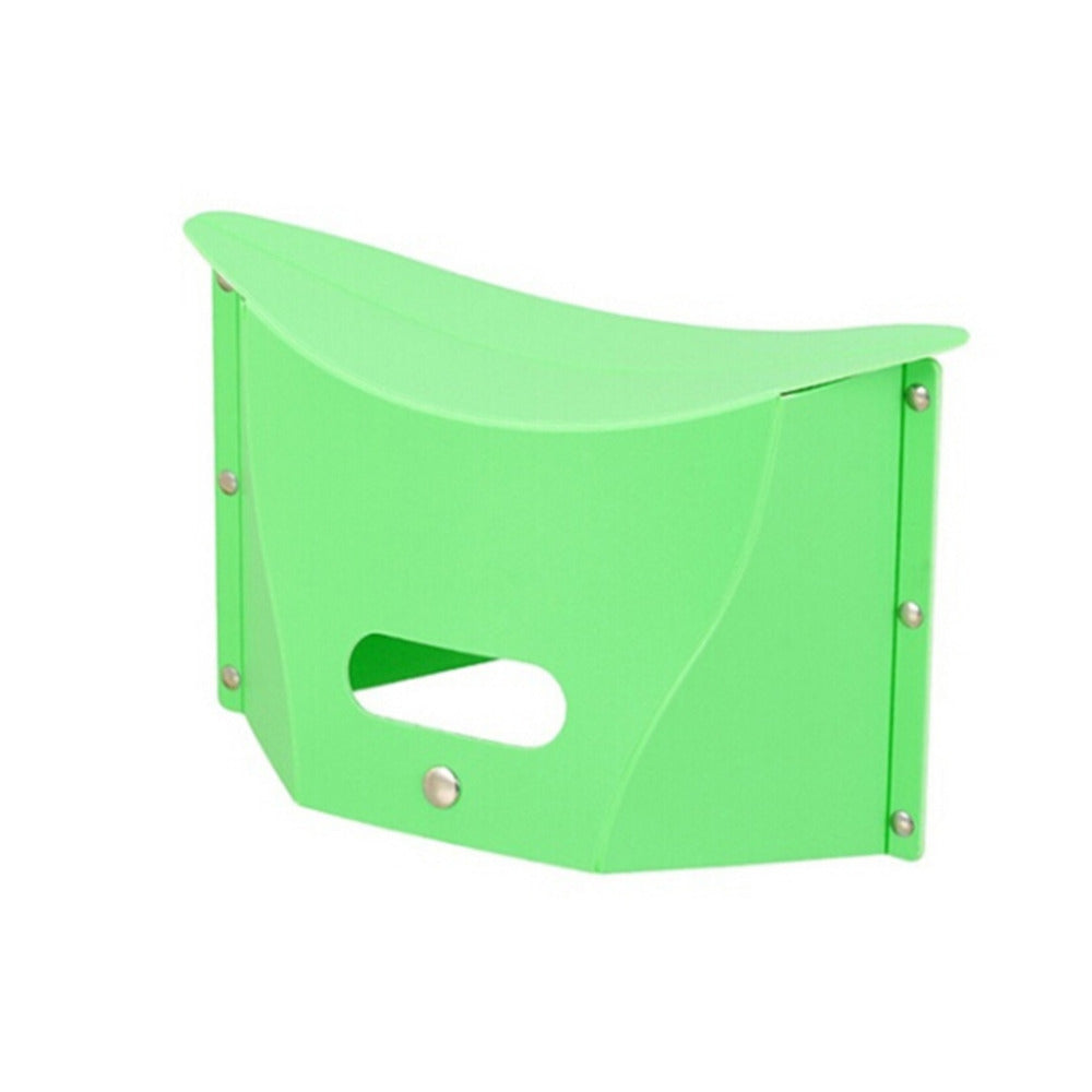 Green folding stool on a white background