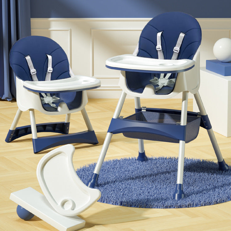 Blue and white baby high chair with tray on a wooden floor.