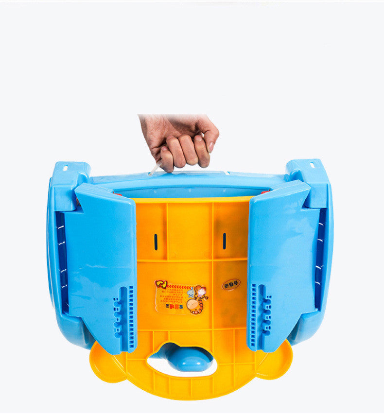 Yellow and blue plastic seat with a hand lifting the lid on a white background