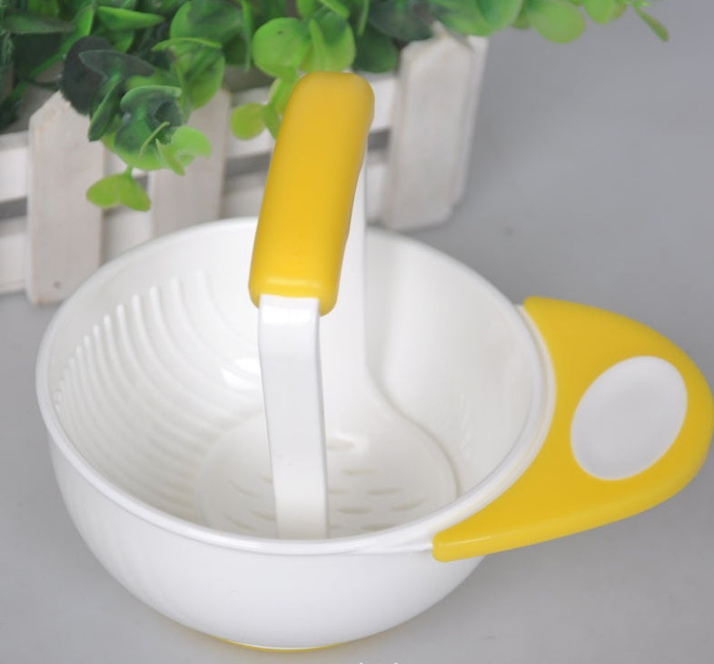 White bowl with yellow handles and a white spoon on a light gray background