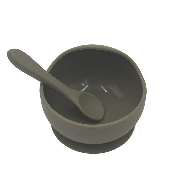 Gray bowl and spoon set on a white background