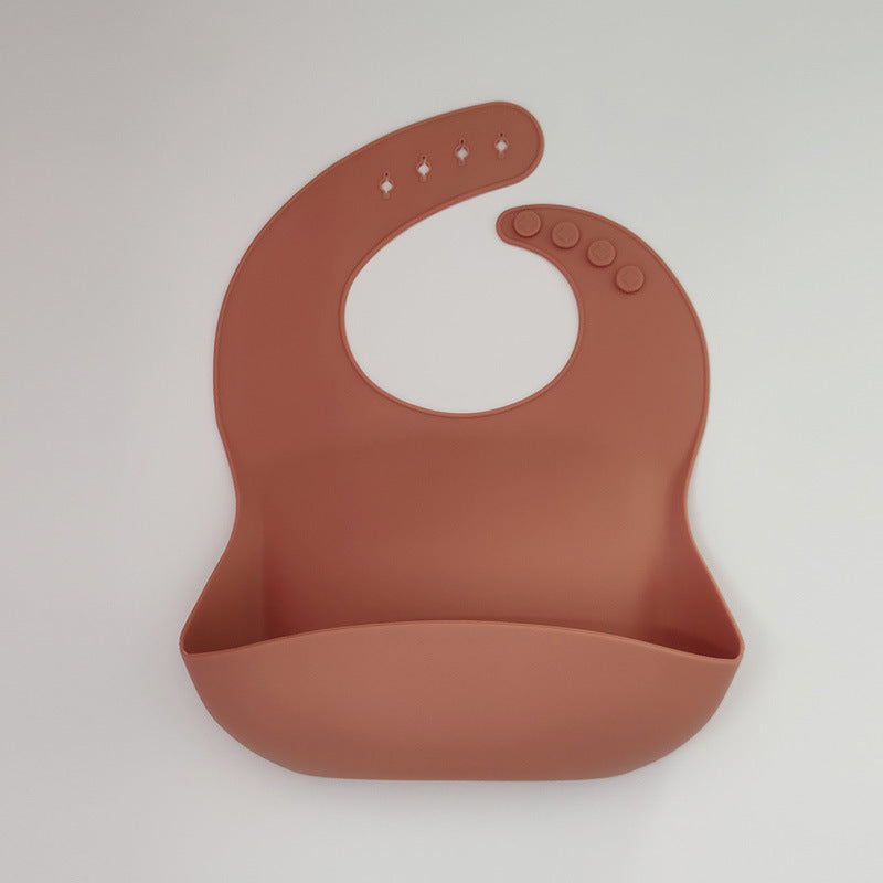 Brown silicone bib on a white background