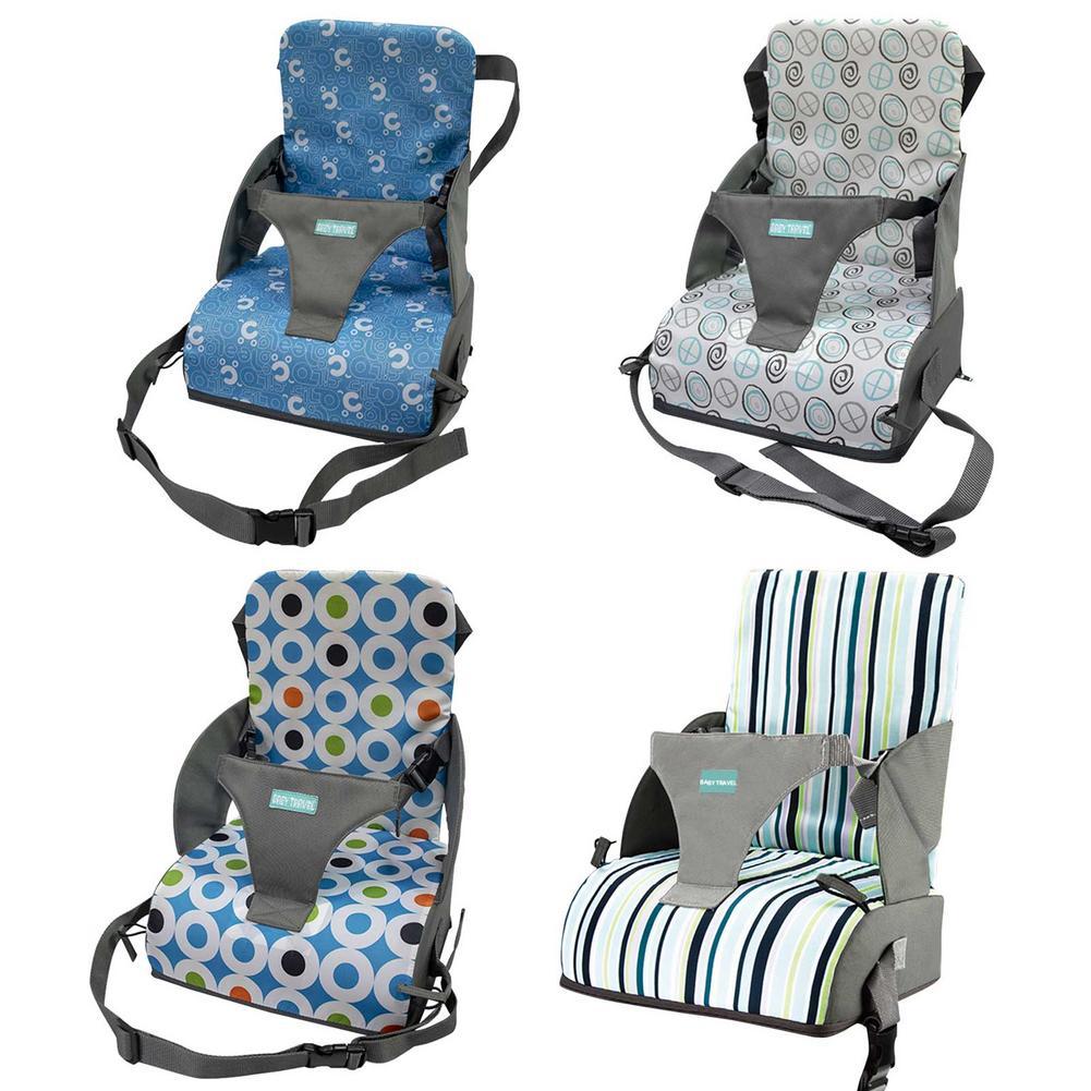 Four baby high chairs with different patterned seats on a white background