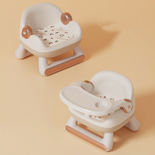 Two baby bath seats with brown accents on a beige background